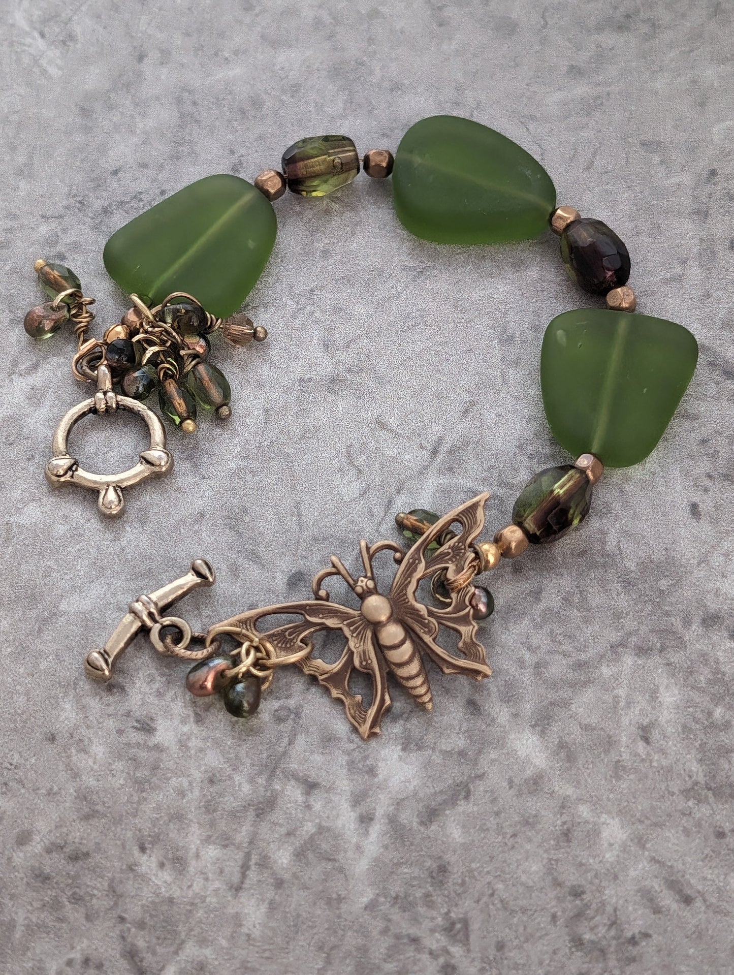 Green Frosted Glass Bracelet with Brass Butterfly