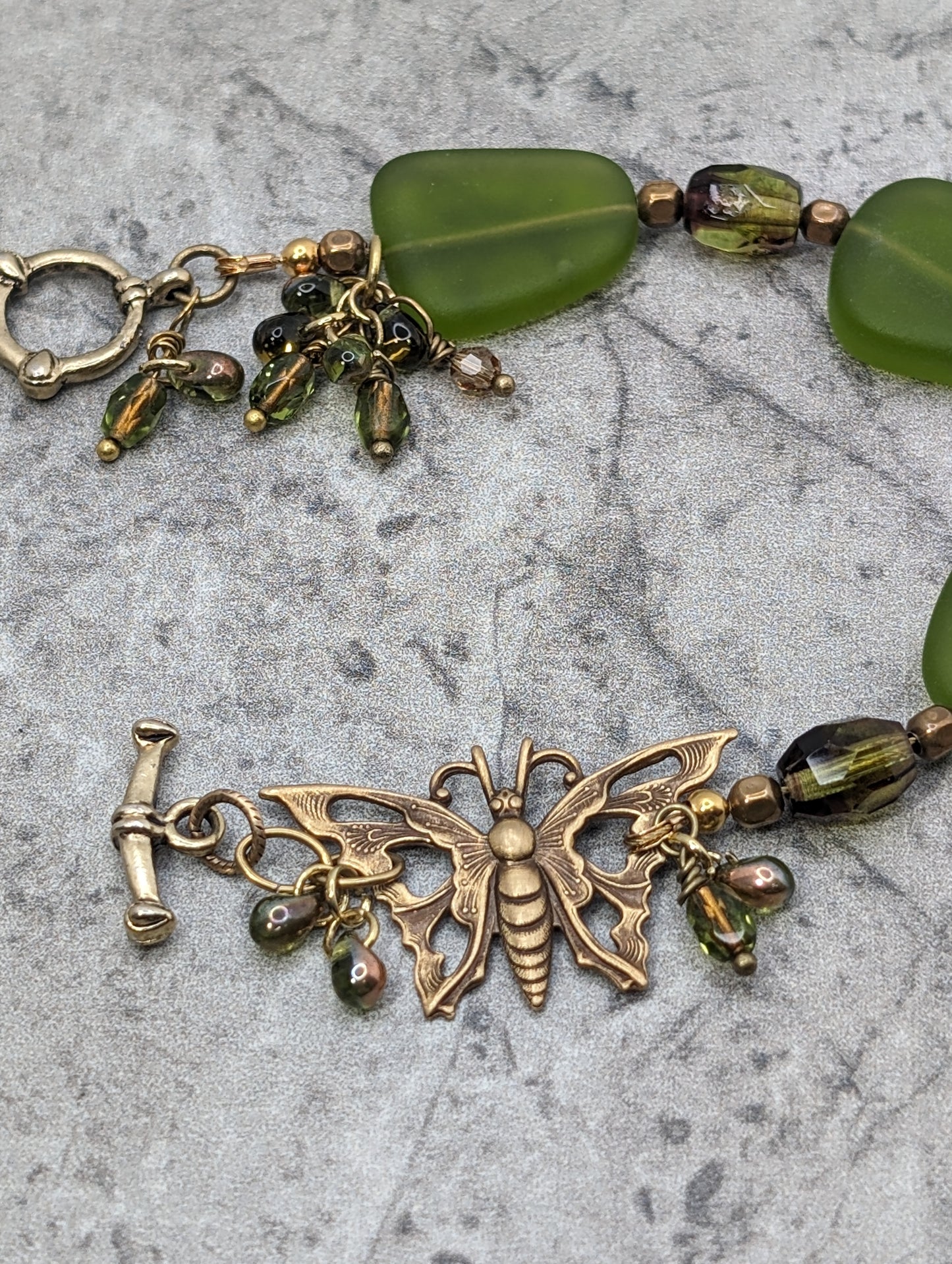 Green Frosted Glass Bracelet with Brass Butterfly
