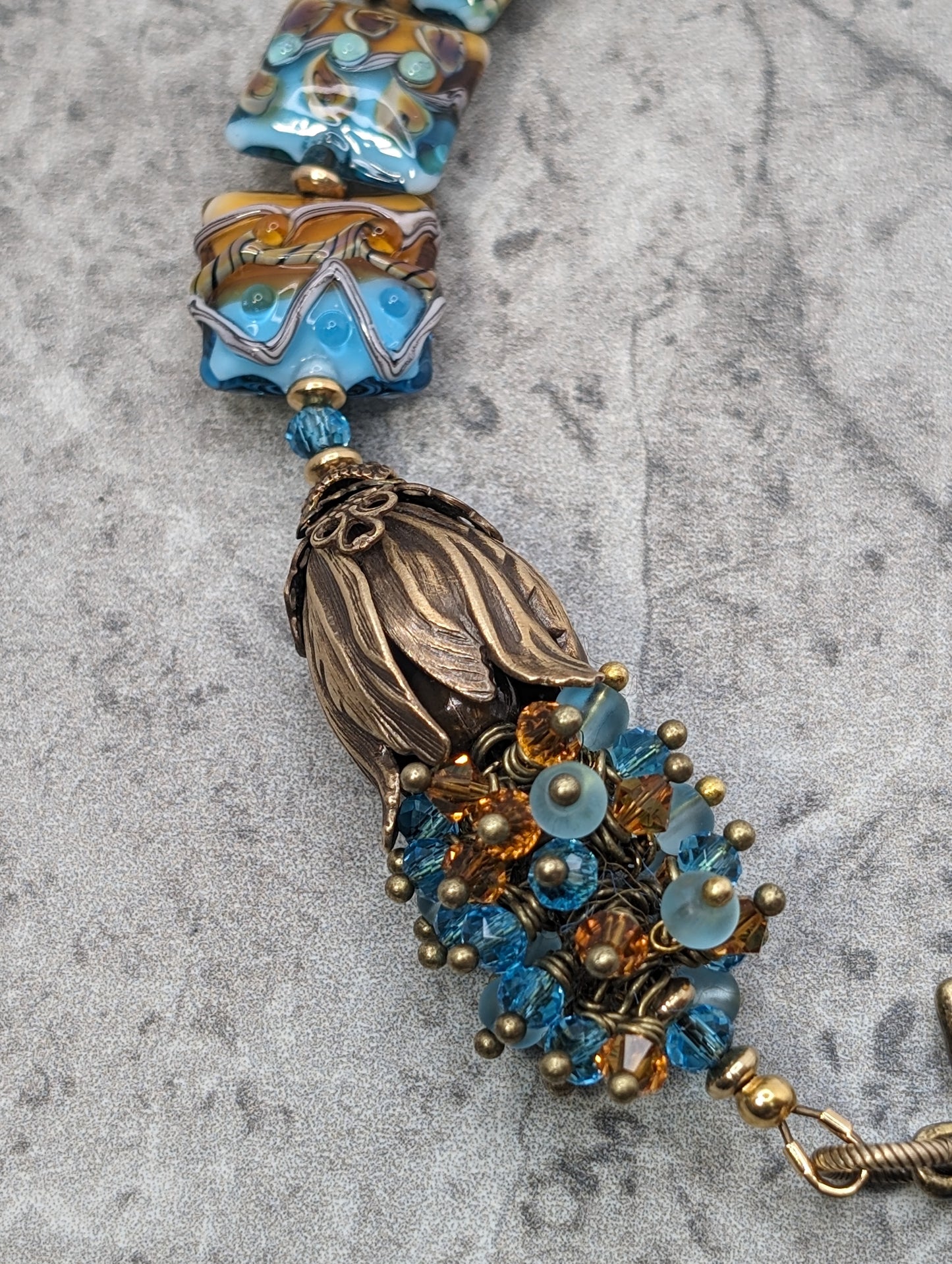 Lamp work Glass Teal & Amber Beads with Brass Tulip Bracelet