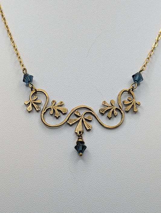 Necklace Hand polished Brass leaves antiqued and accented with deep Blue Austrian Crystals