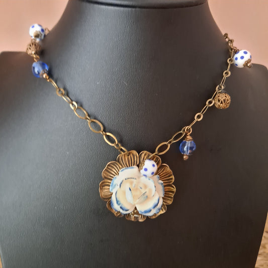 Matte brass necklace with white and blue flower cabochon, glass, ceramic and brass beads.